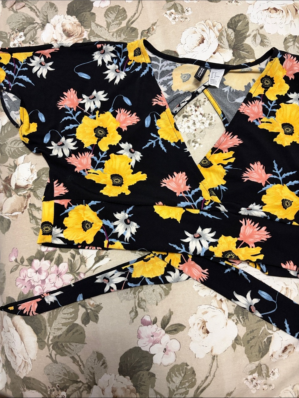 Divided Black Floral Wrap Top with Yellow and Pink Blooms